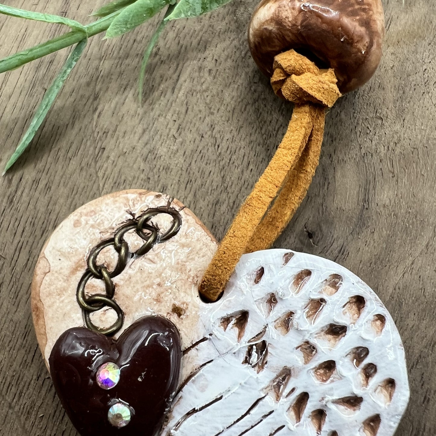 Wings of Devotion | Brown Heart-Shaped Polymer Clay Necklace with White Angel Wings Accent