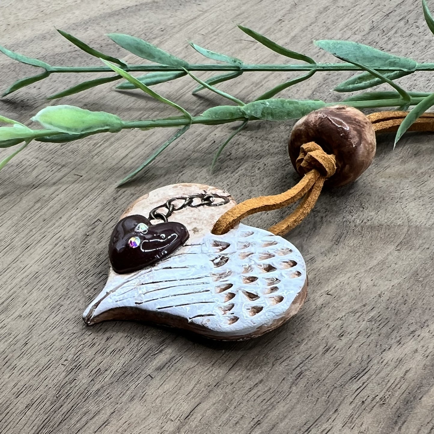 Wings of Devotion | Brown Heart-Shaped Polymer Clay Necklace with White Angel Wings Accent